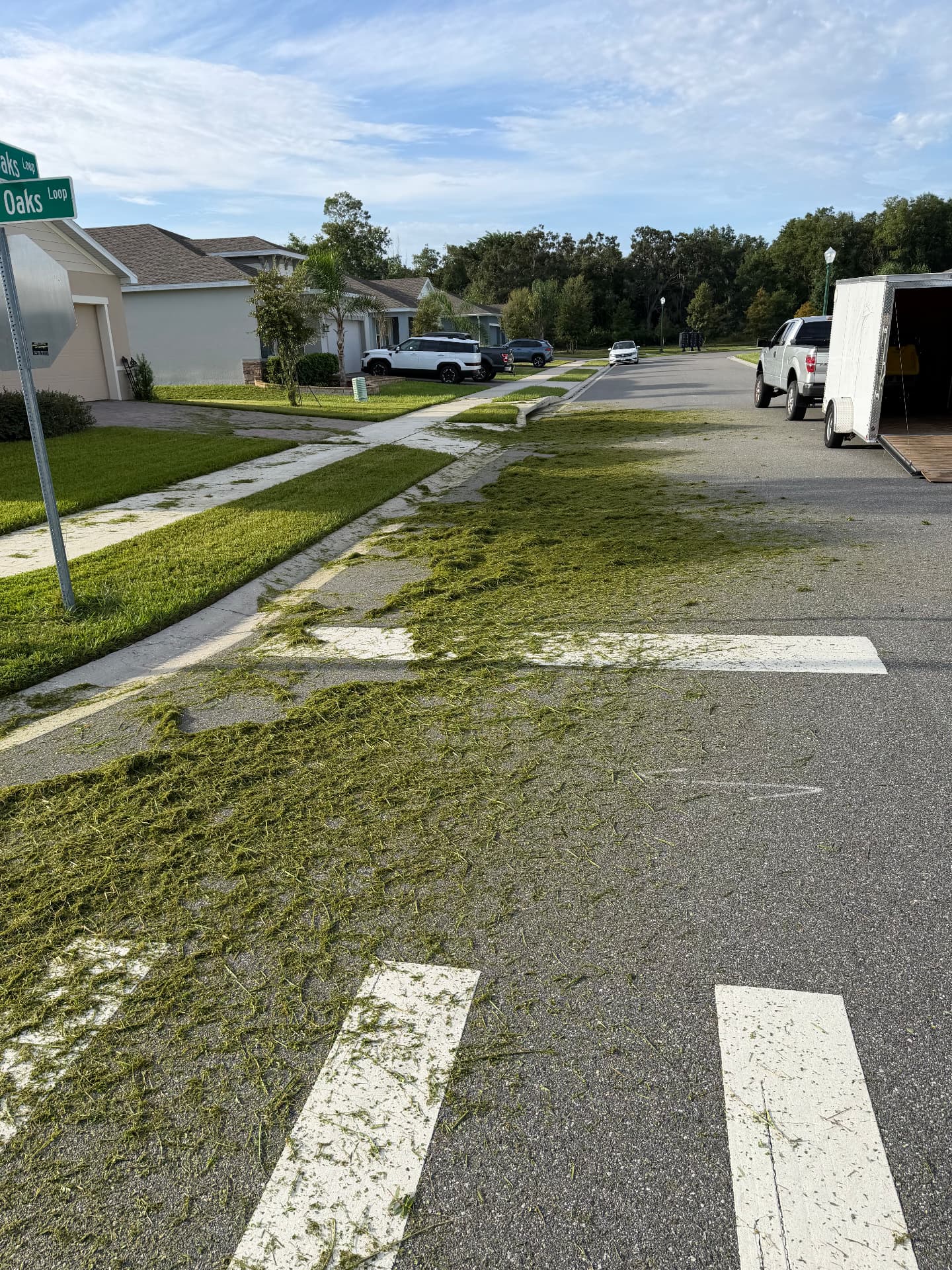 ProCutz truck and trailer parked at a Lake County job site during a mowing route