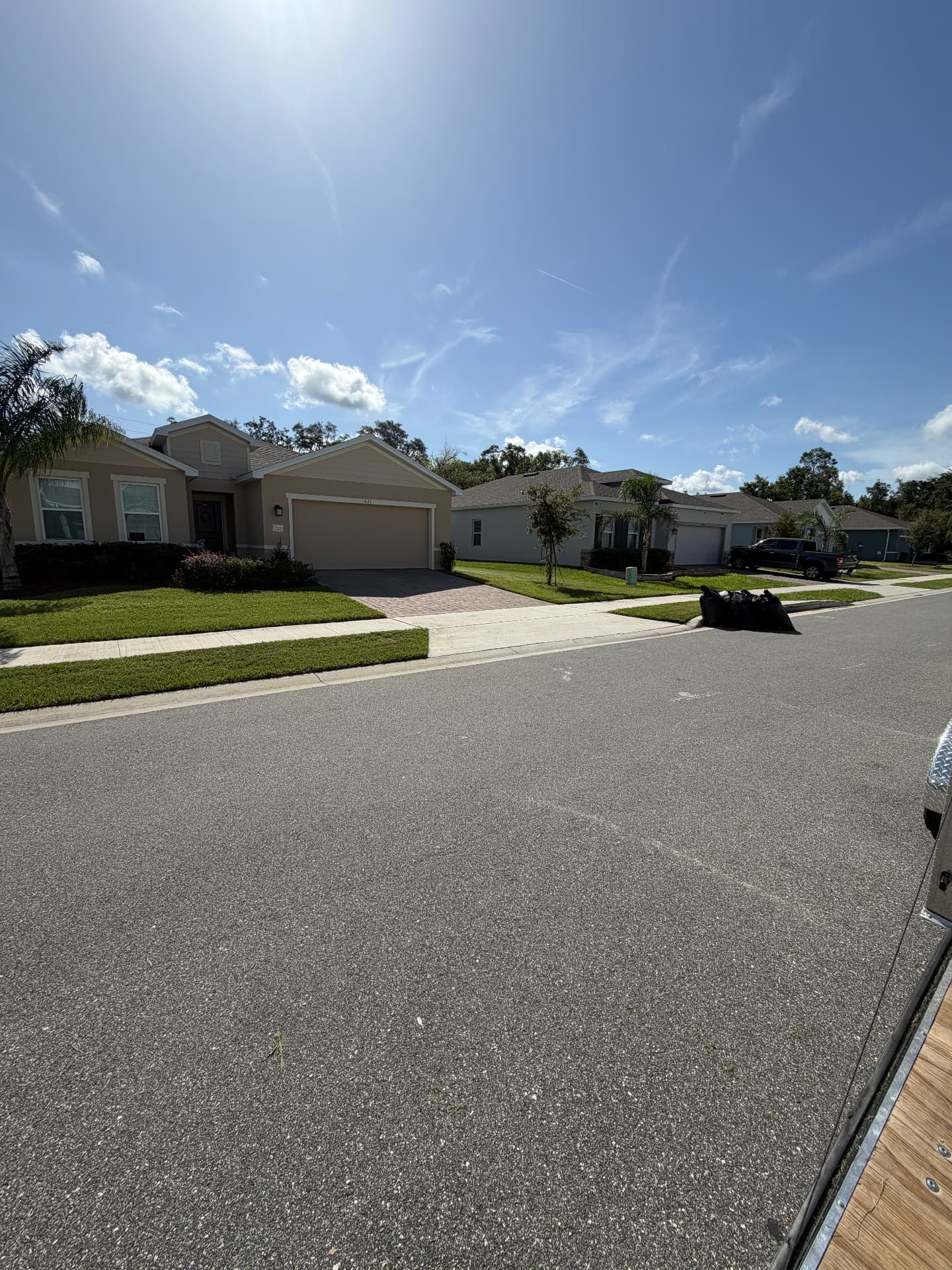Clean street, sidewalk and sharply cut lawn after ProCutz blew off and cleared all clippings